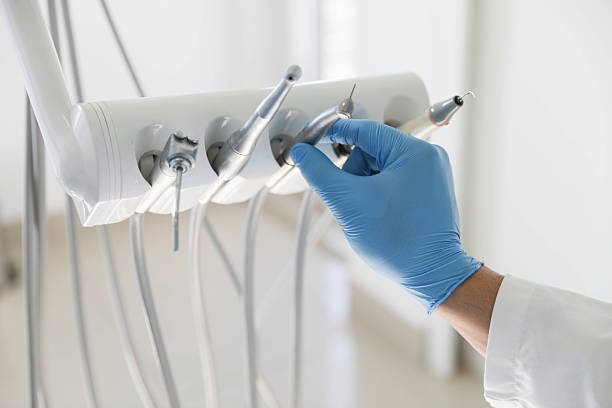 Professional Tooth Extraction technician working in Knoxville, TN